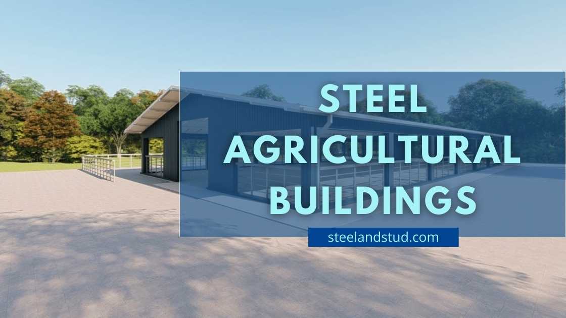 depicts a blue steel agricultural building. The building has a slanted roof and large sliding doors, and is set against a backdrop of trees in a rural area. The text “STEEL AGRICULTURAL BUILDINGS” is overlaid on the image in white capital letters, and the website address “steelandstud.com” is displayed in white letters in the bottom right corner.