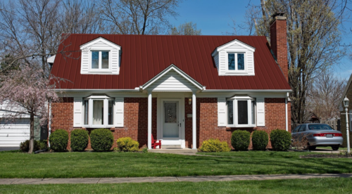 Brick House With Red Metal Roof