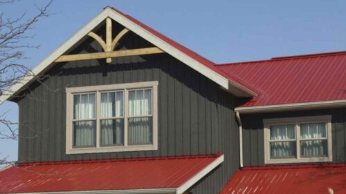 Red Metal Roof with Brown House