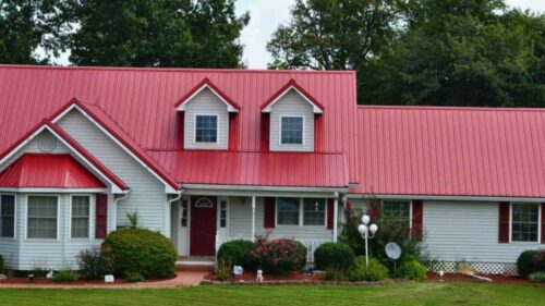 Pink House With Red Metal Roof