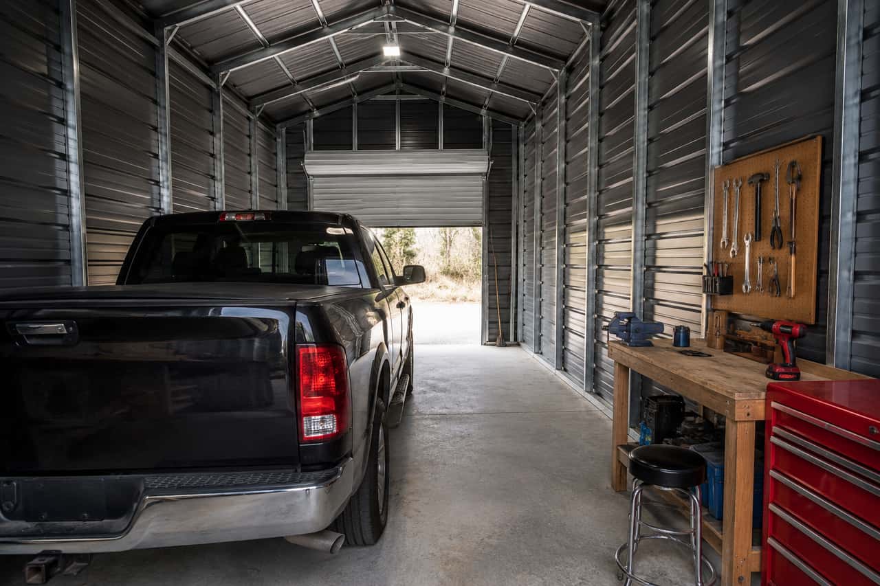 14x24 small business shop set up as a working workshop with a workbench and pickup truck