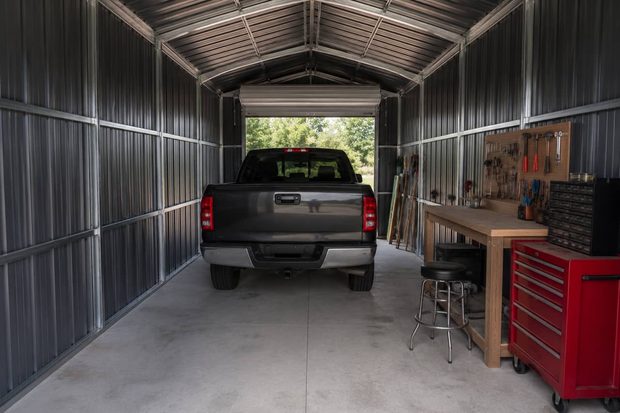 14x24 small business shop set up as a working workshop with a workbench and pickup truck