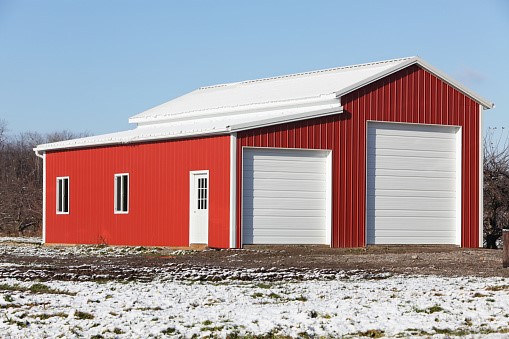 24x32 metal building: free-standing fully enclosed view (768 sq ft, proportion-matched from 30×40 source) from Steel and Stud