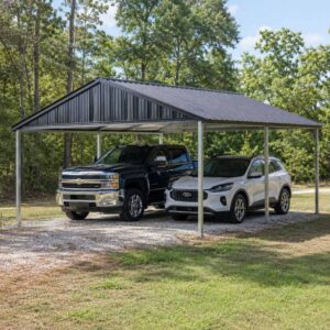 24x24 metal carport - compact open-sided carport for two vehicles with charcoal vertical-rib roof on rural lot