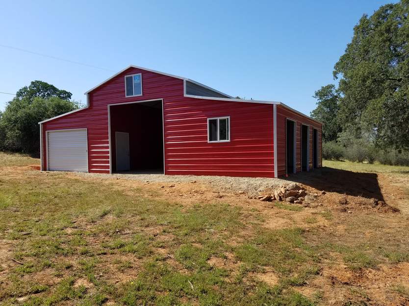 Real Steel and Stud install: 18×31×12 metal barn with engineered roof and side panels