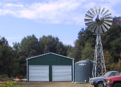 Real Steel and Stud install: 24×61×11 metal building with A-frame roof with vertical panels