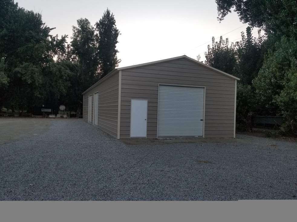 Steel and Stud customer install — 25×76×12 metal building, A-frame roof with vertical panels