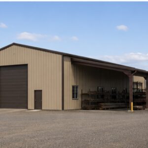 30×30 prefabricated steel small manufacturing or fabrication bay with attached open-sided lean-to for covered material and scrap storage in tan desert beige steel, dealer-installed by Steel & Stud