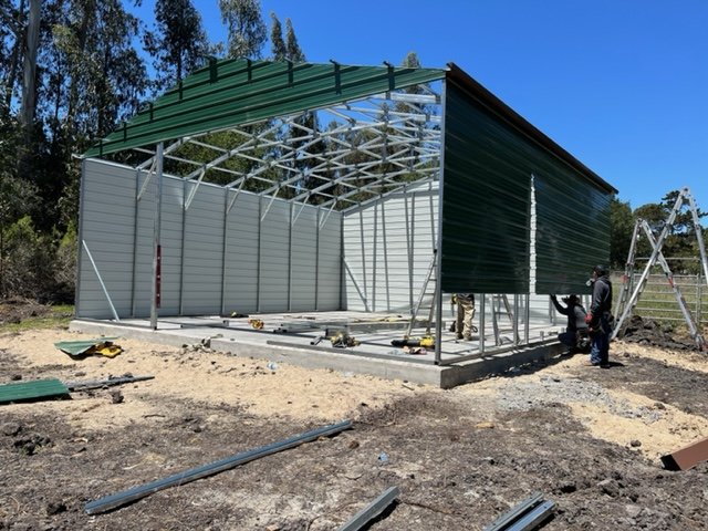 Custom 30×33×12 metal building from Steel and Stud, engineered with all-vertical roof and side panels