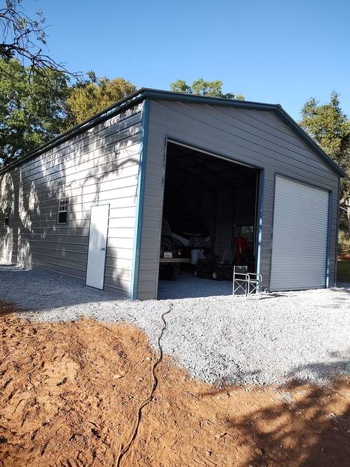 Steel and Stud customer install — 30×51×14 steel garage, A-frame roof with vertical panels