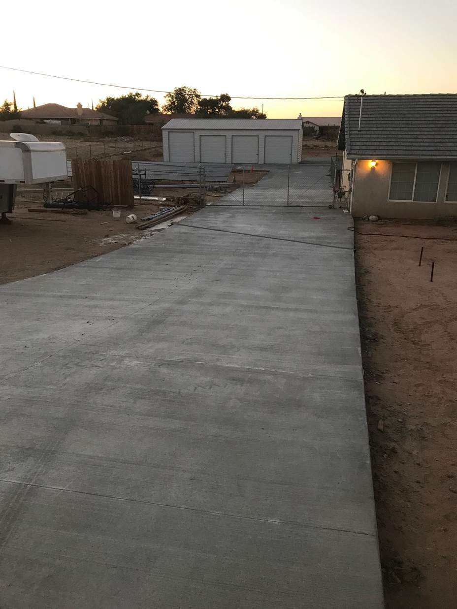 30×53×12 metal building installed by Steel and Stud — engineered roof and side panels with 10×10 and 10×12 roll-up doors