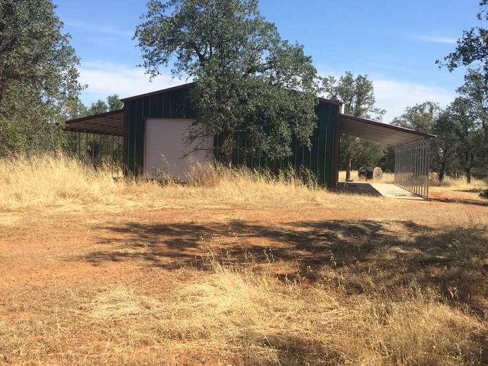 Steel and Stud customer install — 54×51 metal building, engineered roof and side panels