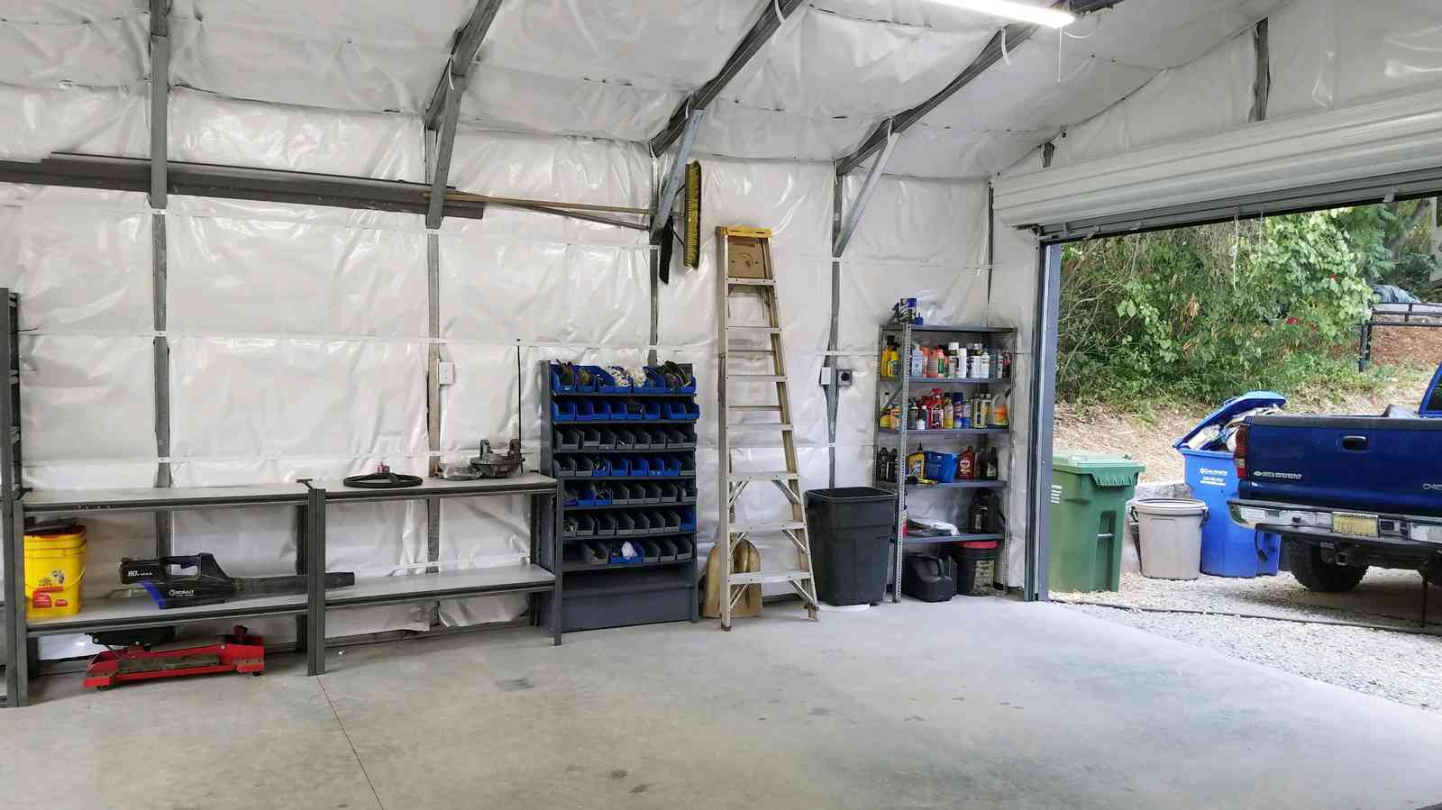 Real Steel and Stud install: 28×31×9 metal building, Maryland with engineered roof and side panels — interior buildout view