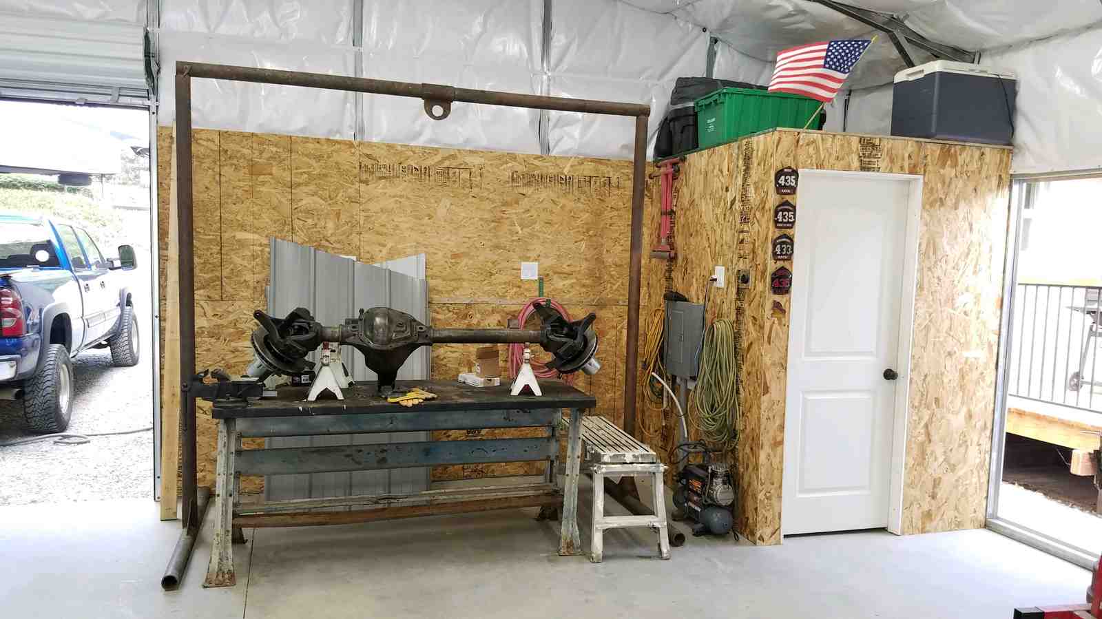 28×31×9 metal building installed by Steel and Stud, Maryland — engineered roof and side panels and a 10×8 roll-up door — interior buildout view