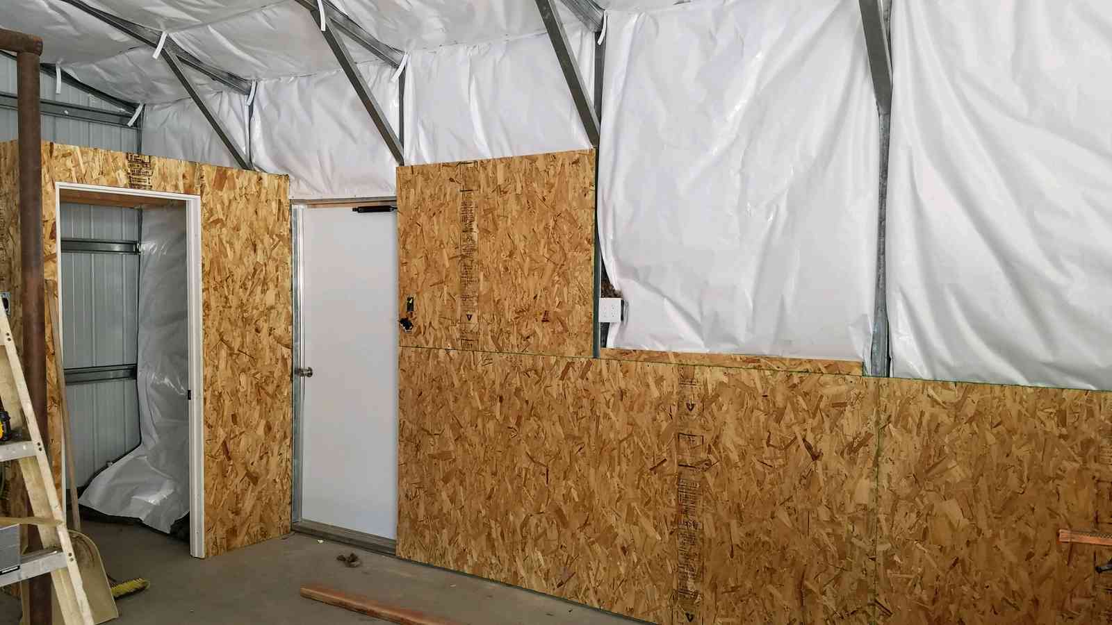 Steel and Stud customer install — 28×31×9 metal building, Maryland, engineered roof and side panels — interior buildout view