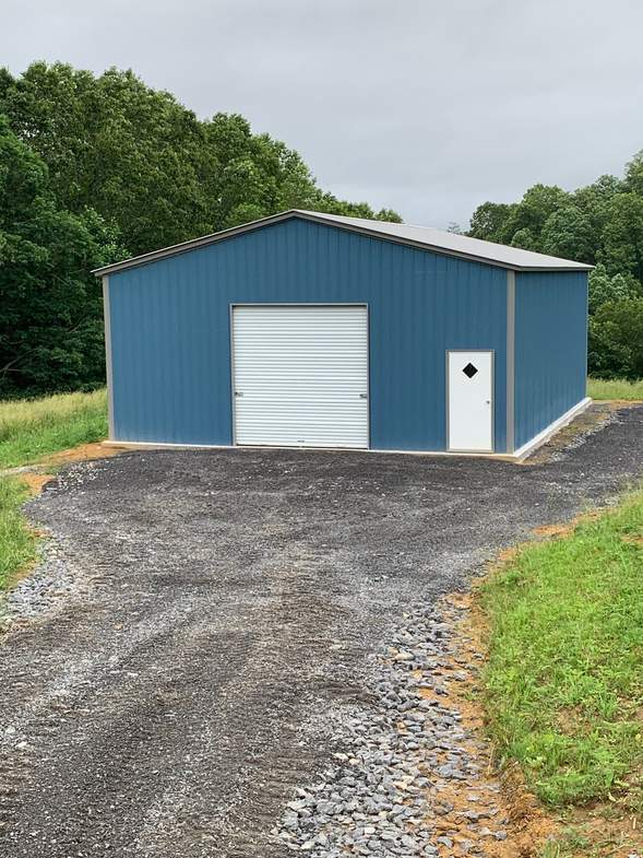 30×41×12 metal building installed by Steel and Stud, West Virginia — engineered roof and side panels and a 10×10 roll-up door