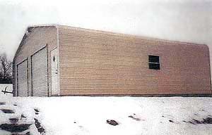 Real Steel and Stud install: metal building with engineered roof and side panels