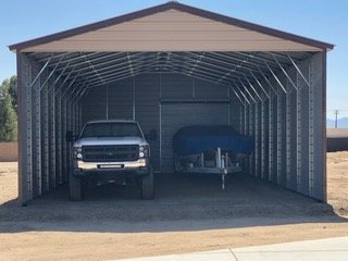 24×46 metal building installed by Steel and Stud — engineered roof and side panels and a 10×10 roll-up door — Stevenson Cale customer install