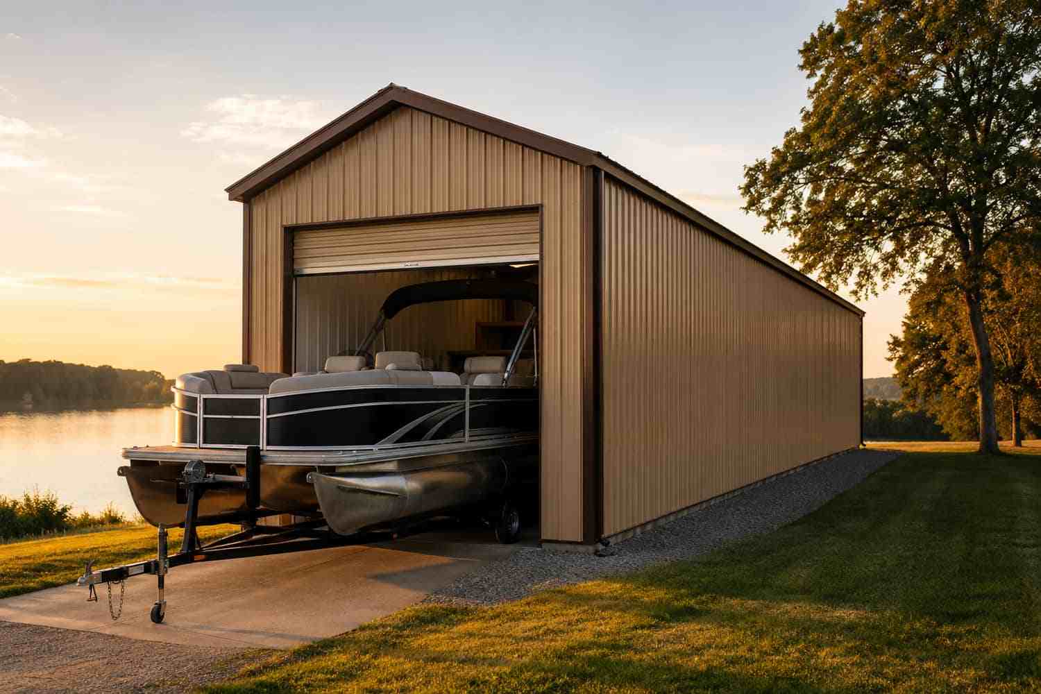 Tan steel building at sunset with a pontoon boat exiting the metal garage door lakeside