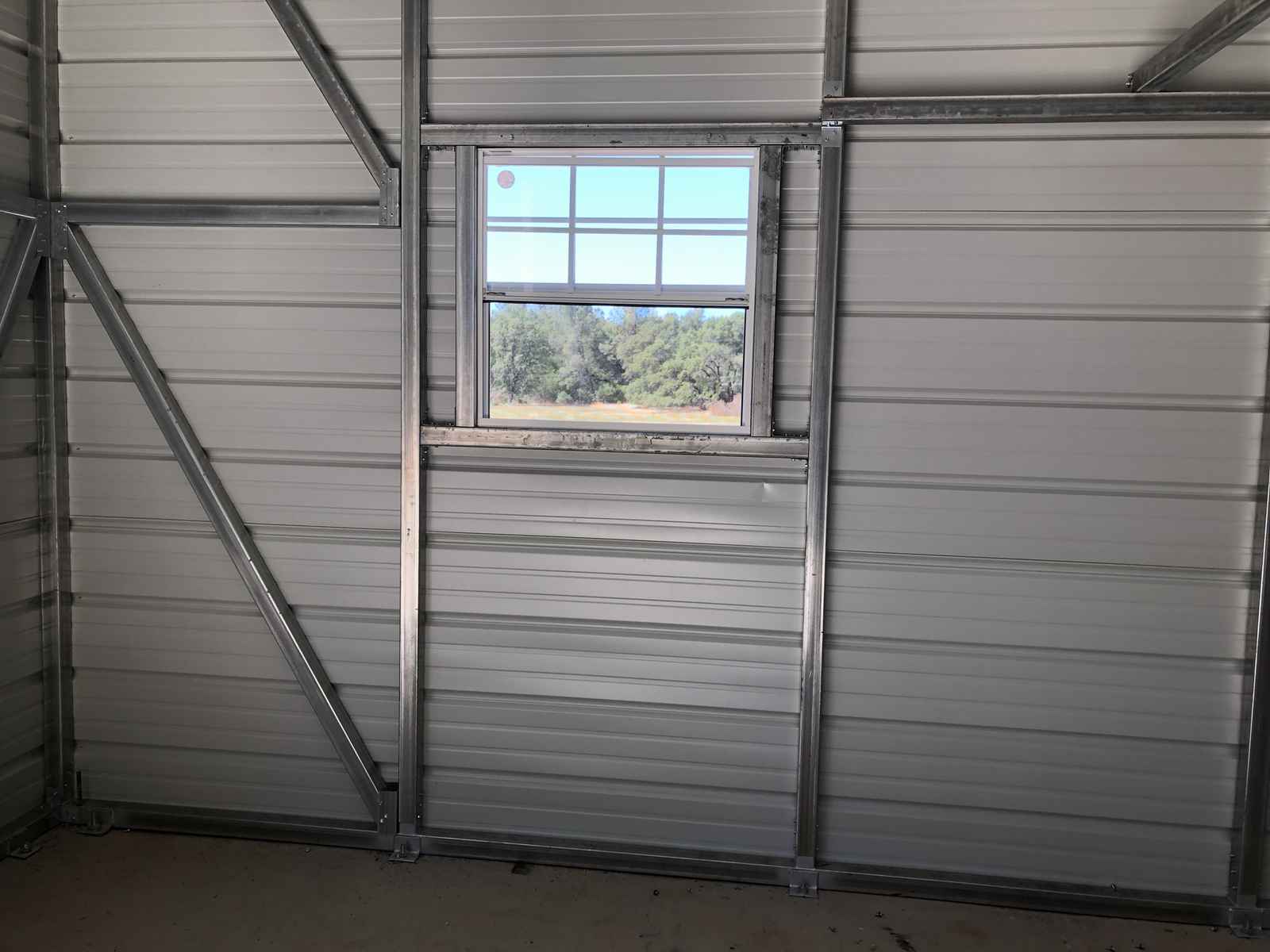 Custom metal building from Steel and Stud, engineered with engineered roof and side panels — Tong customer install (California)